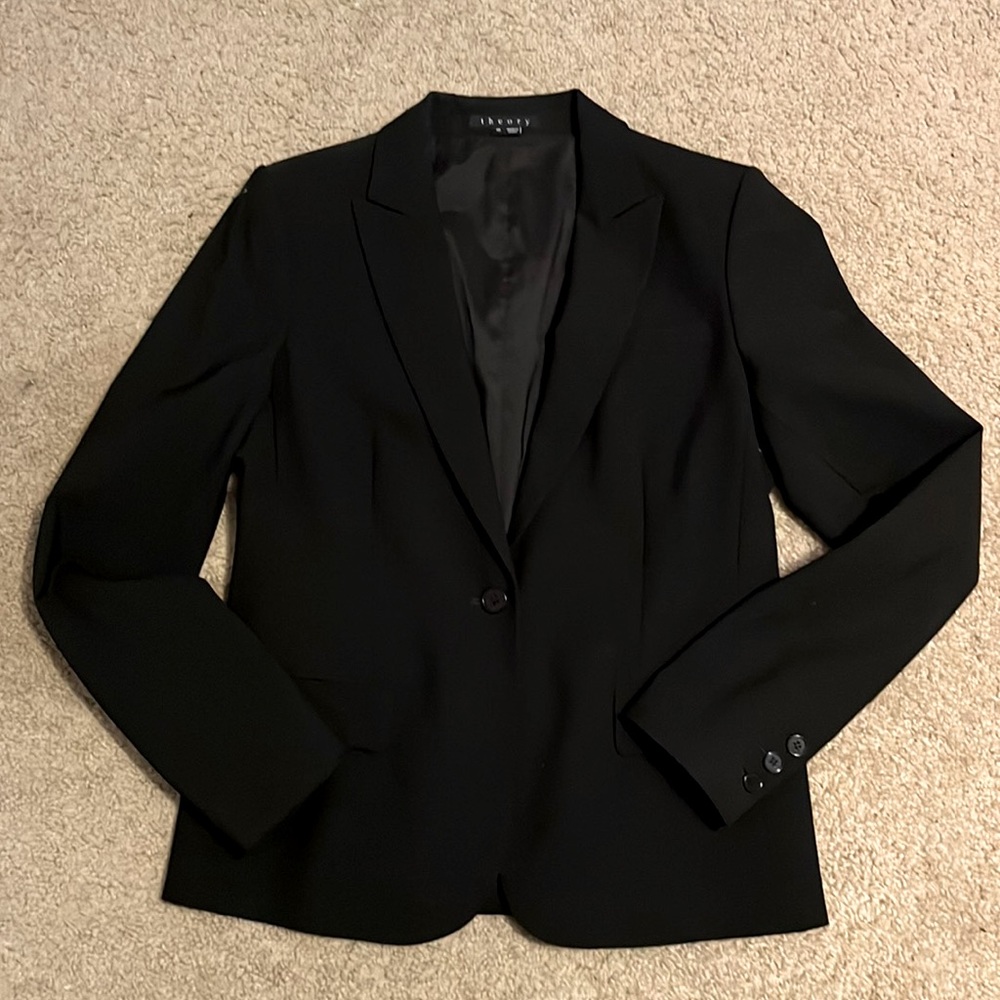 Black slim fit blazer with built in shoulder pads. Pinstripe interior. New worn!